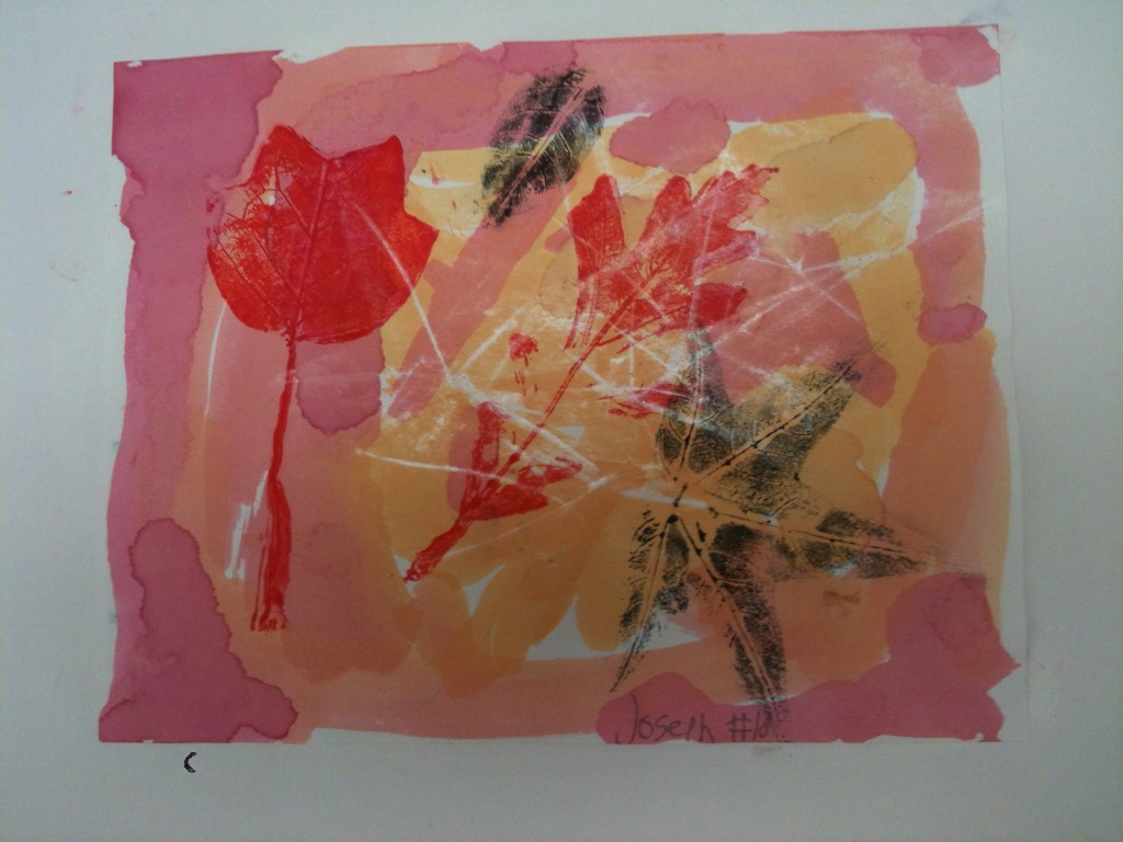 Second graders use watercolor markers to make colorful leaf prints.