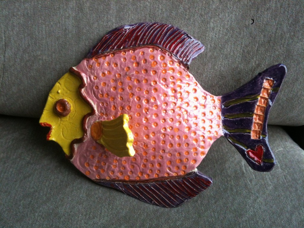 Done! Artist added fin, and stamped name in tail using letter stamps.