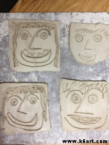 First graders created self-portraits using clay slabs. Allow two 40-minutes sessions plus drying time.