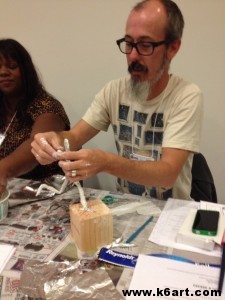 Local art teacher making a sport trophy sculpture